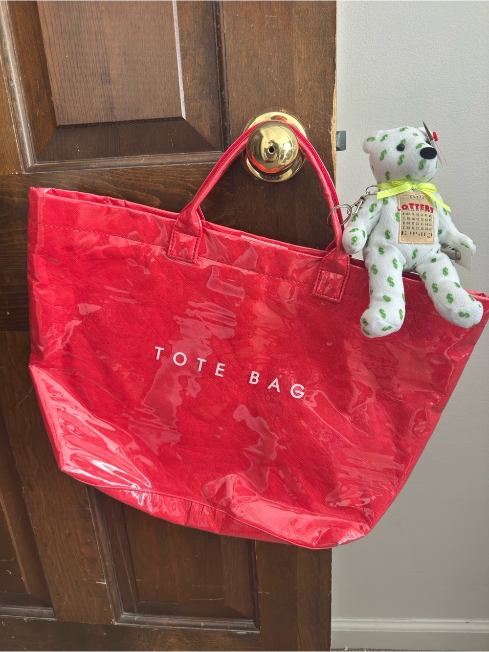 Red Vinyl Tote Bag with 'TOTE BAG' Print